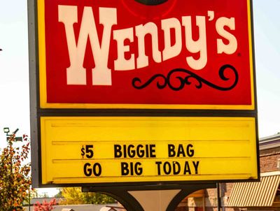 Wendy's restaurant sign displaying a promotion for the $5 Biggie Bag with the slogan 'Go Big Today
